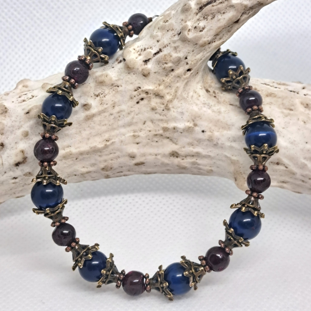 6 3/4" Midnight Catseye and Garnet Bracelet.